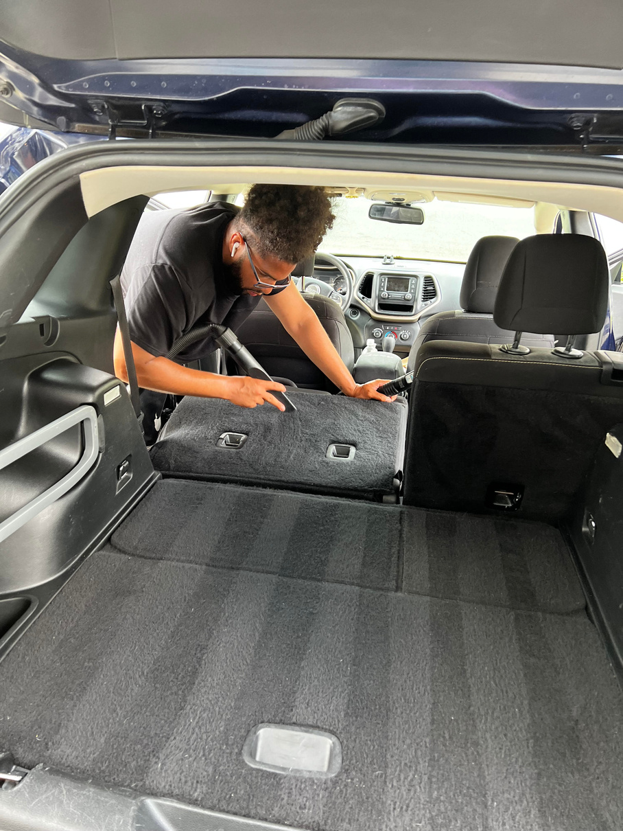 Peter detailing a car interior with professional equipment